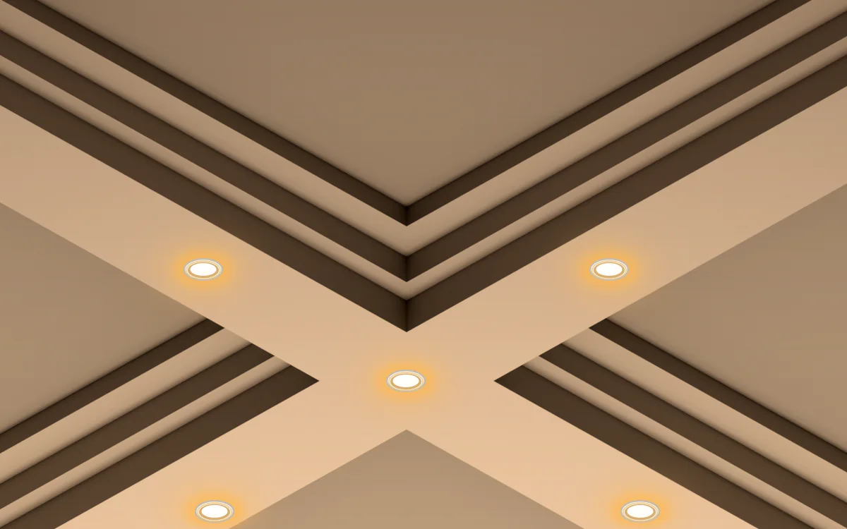 Intersection de poutres à caissons IB-15 en plâtre blanc avec spots encastrés chauds centrés